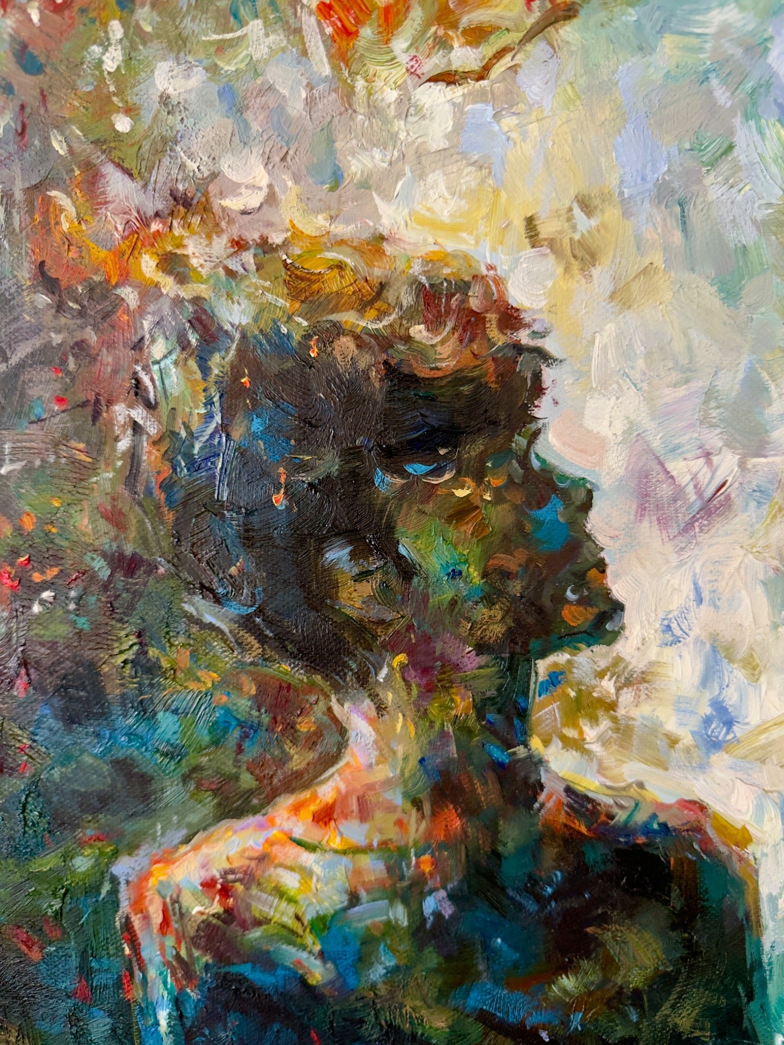 Close photograph of the figure in the forest showing expressive raised paint and a profile