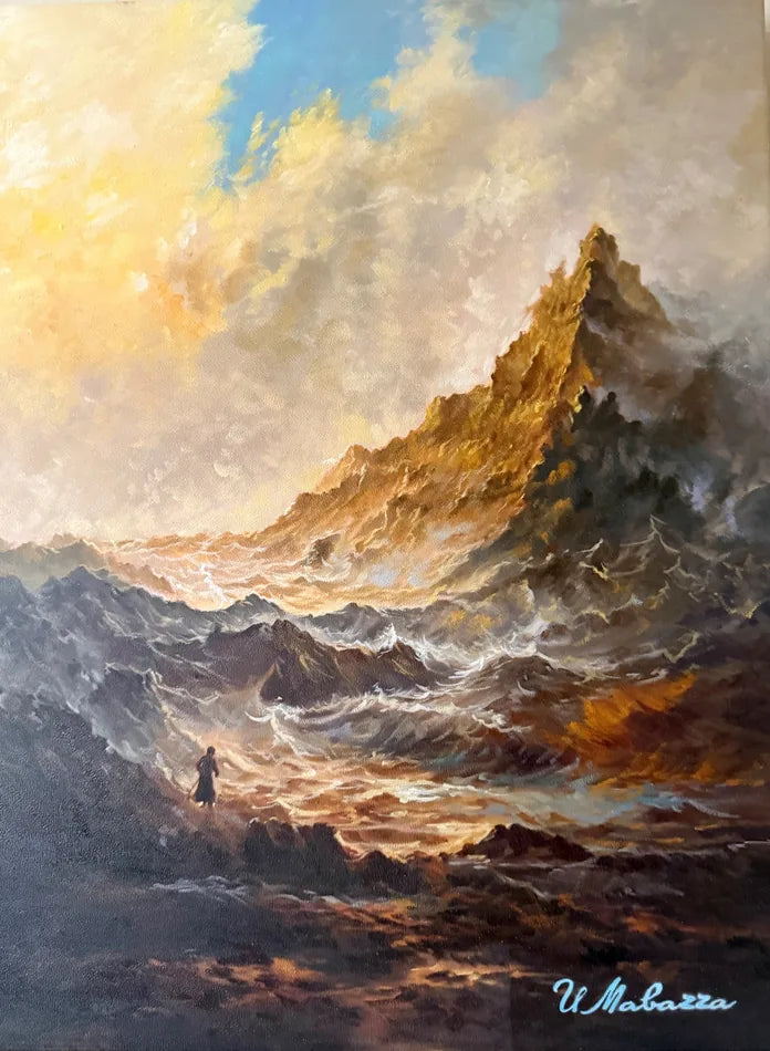 Sunlit sea and waves beneath a dramatic rocky mountain and glowing sky.
